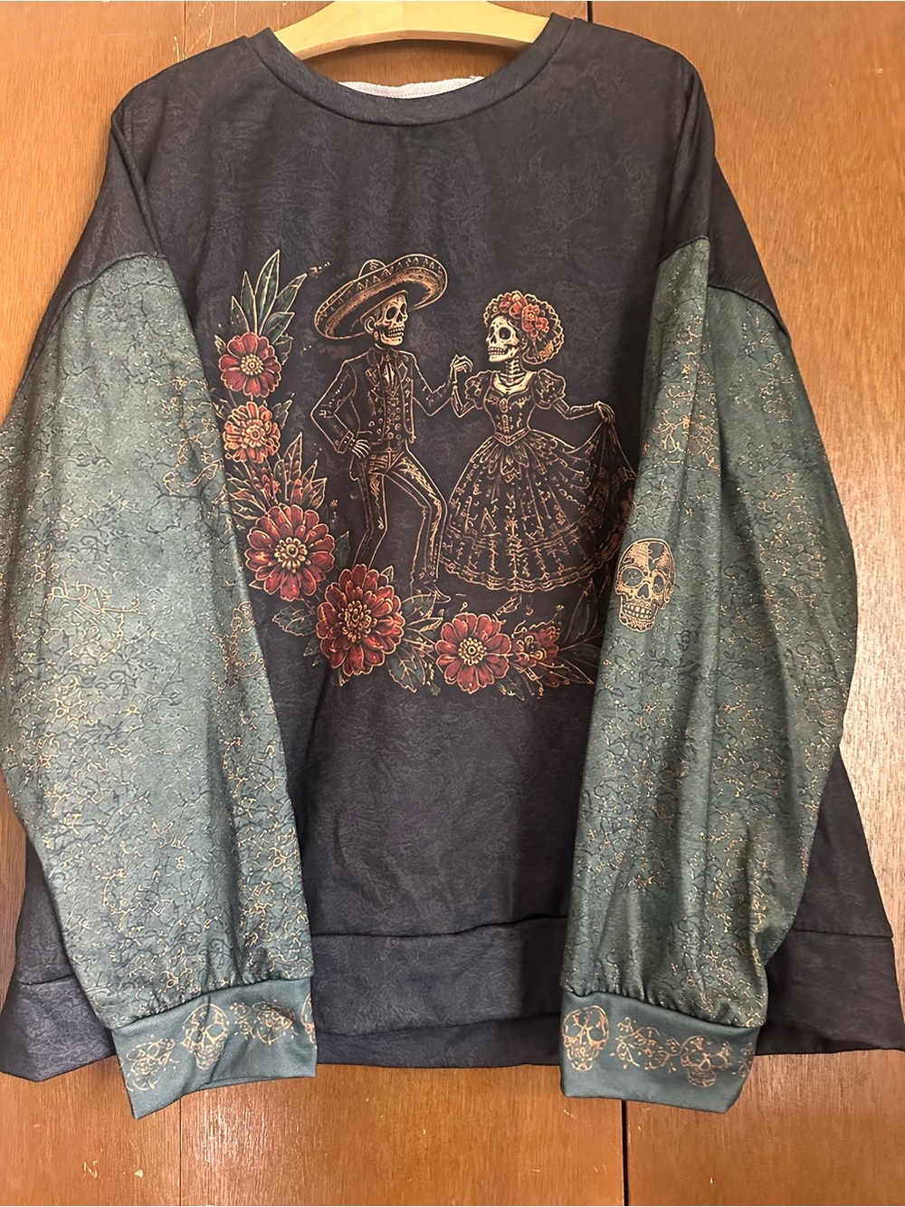Women's Black Graphic Day of the Dead Sweatshirt with Teal Sleeves